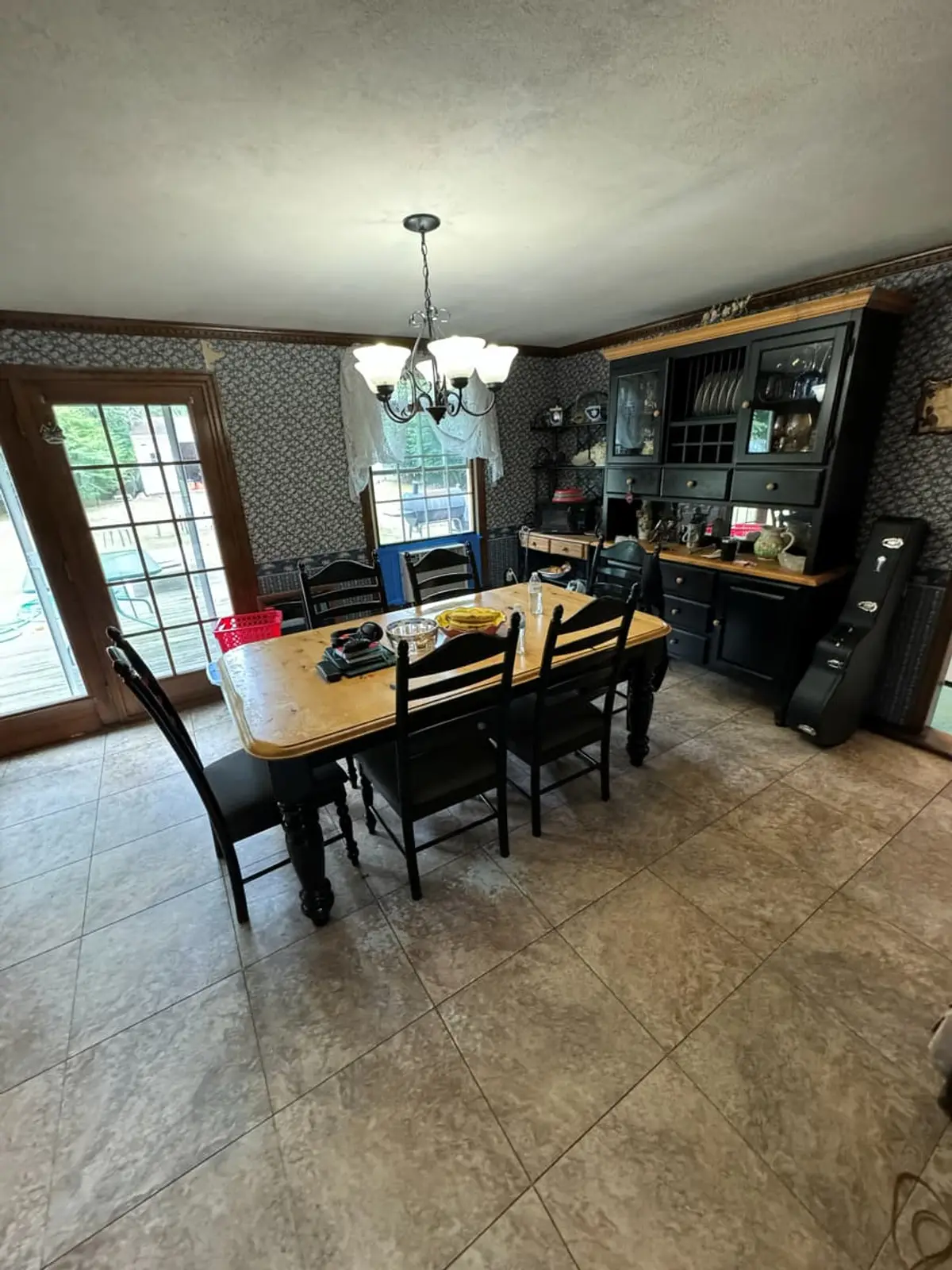 Selling a house during a divorce in Medford: dining area with a farmhouse table and French doors