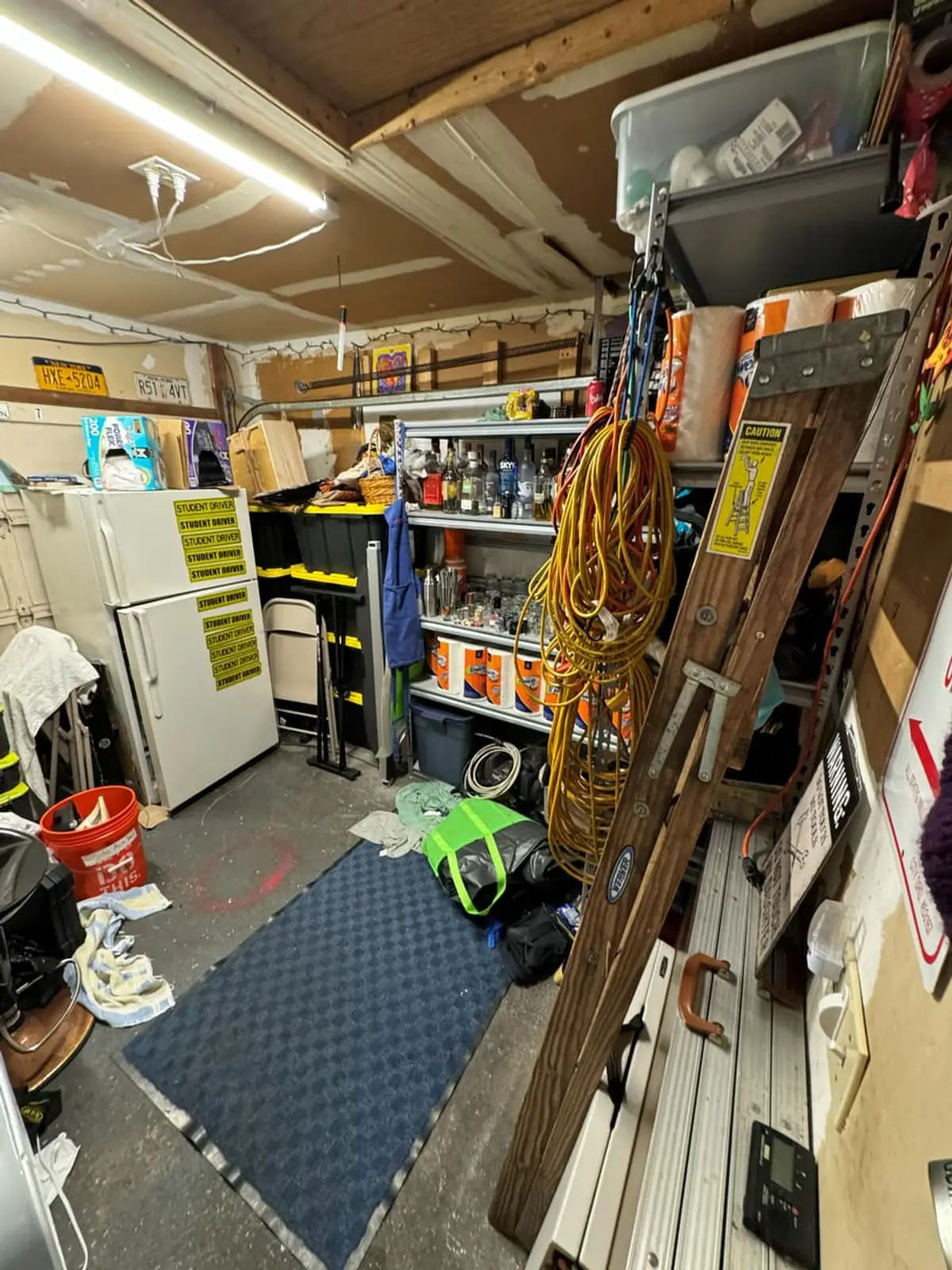 Dealing with squatters or holdover tenants in Medford: garage lined with shelving, tools and stored gear