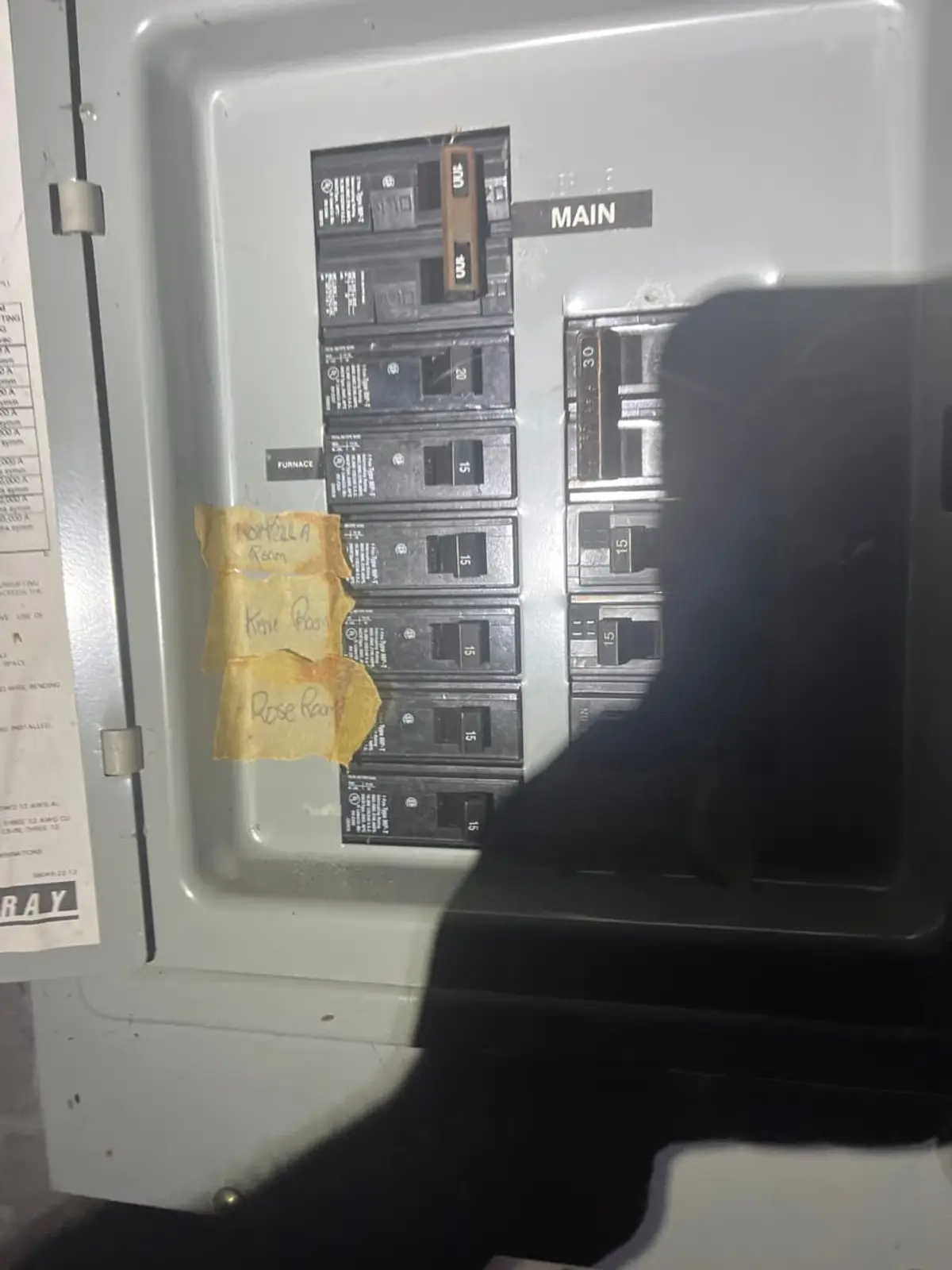 Downsizing or retiring in Medford: old electrical panel with handwritten labels