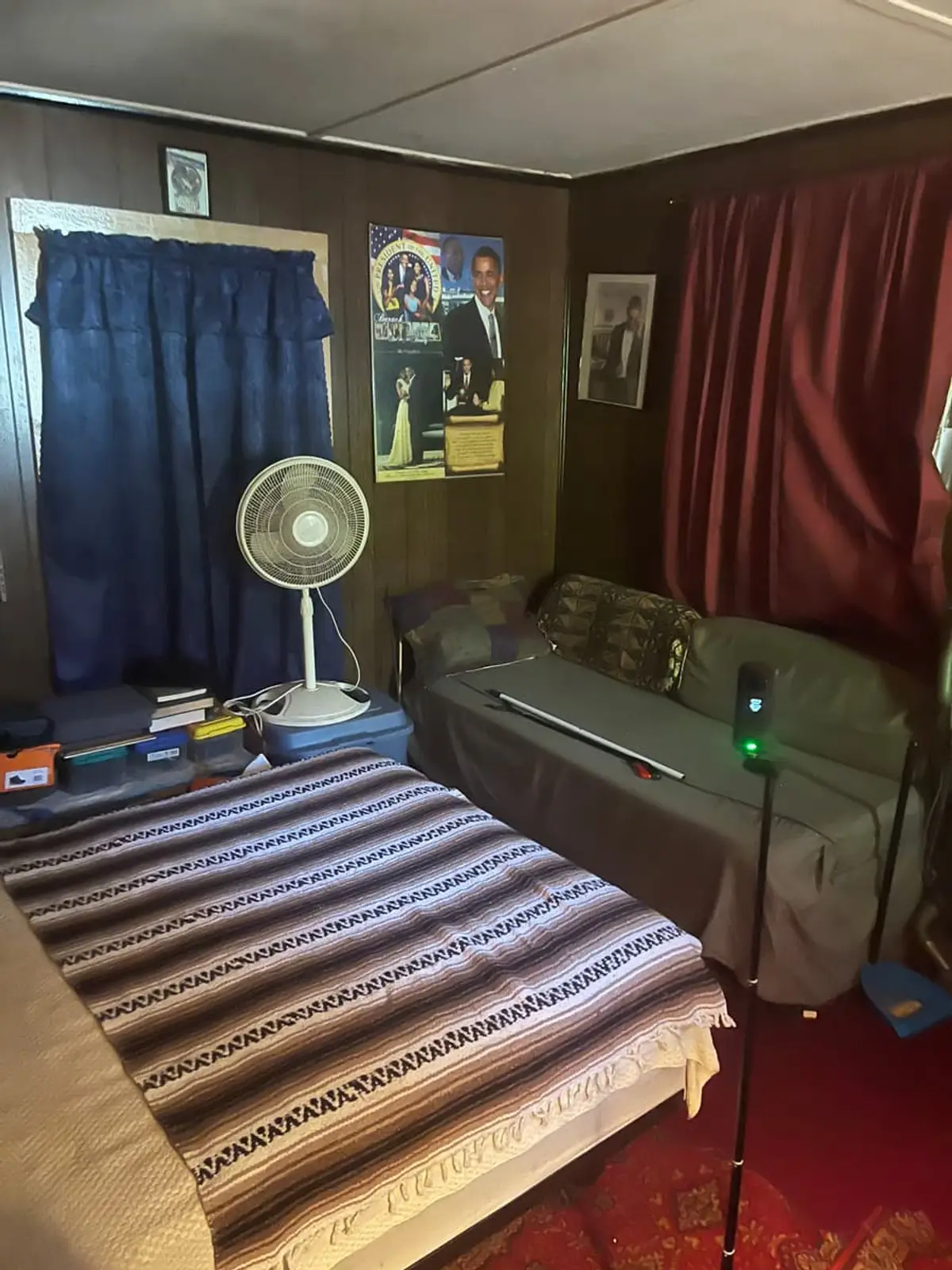 Selling estate property as an executor in Medford: wood-paneled bedroom with a striped blanket